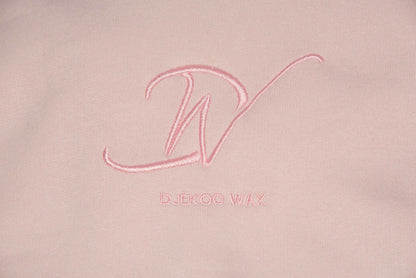Broderie logo Djêkoo Wax sur sweat à capuche bio femme rose